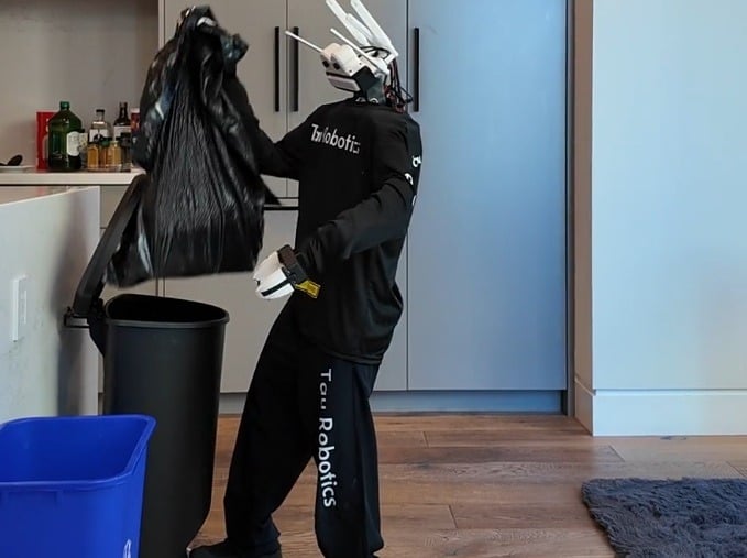 Tau Robotics launches humanoid robot cleaning service in SF for USD 30/hour San Francisco startup Tau Robotics has launched a humanoid robot home cleaning service at USD 30 per hour, with each robot jointly controlled by a remote human operator and AI. The service is initially invite-only as the company scales operations, with access expanding through a waitlist. The robots handle tasks like vacuuming, wiping counters, and basic tidying, with a human operator monitoring and intervening via camera feeds.